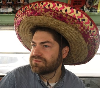 Michael Corey from Reveal with the mexican hat in the bus.